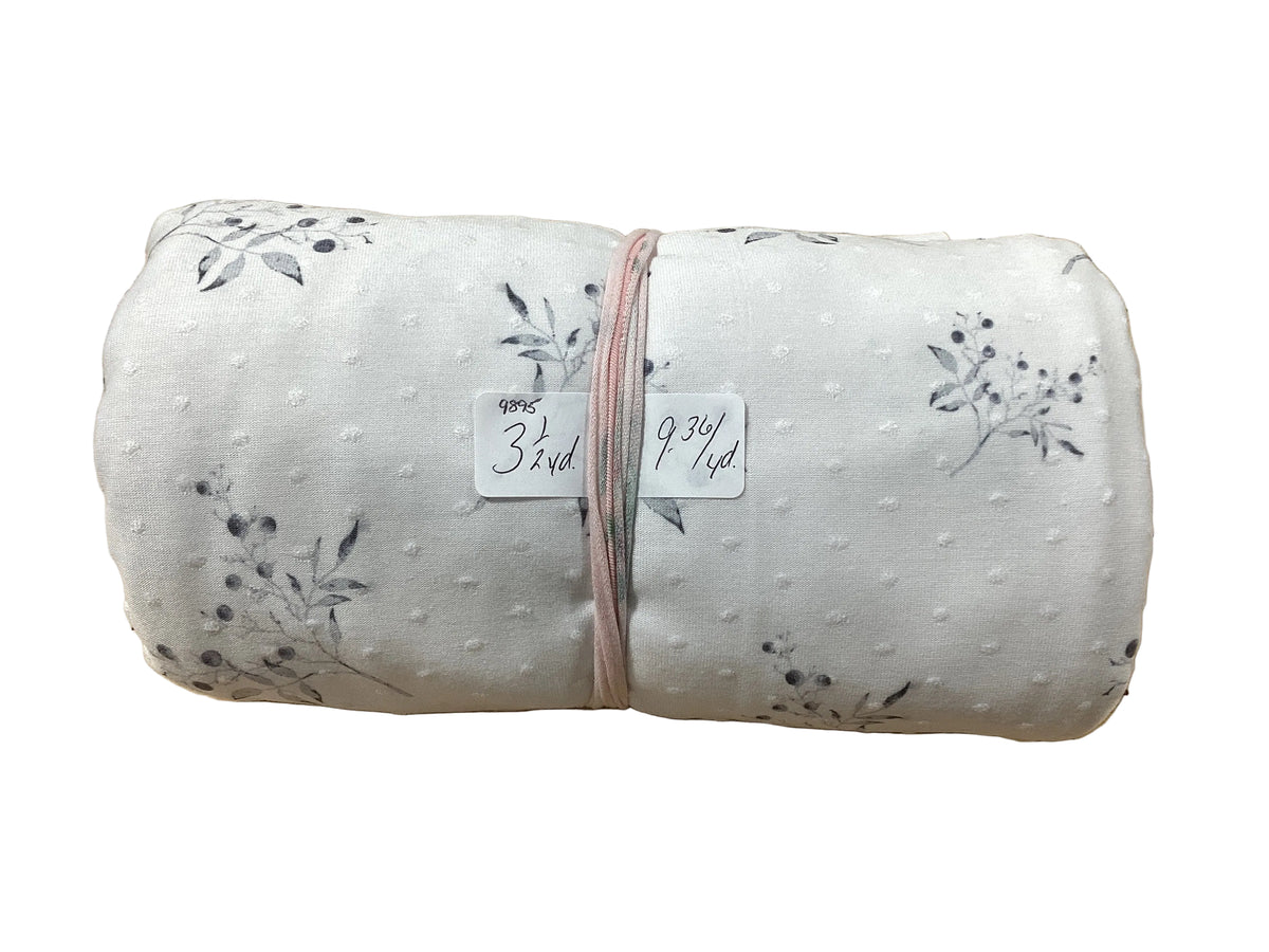Remnant - Swiss dot knit, gray stems, 3 1/2 yd. @ $9.36/yd.